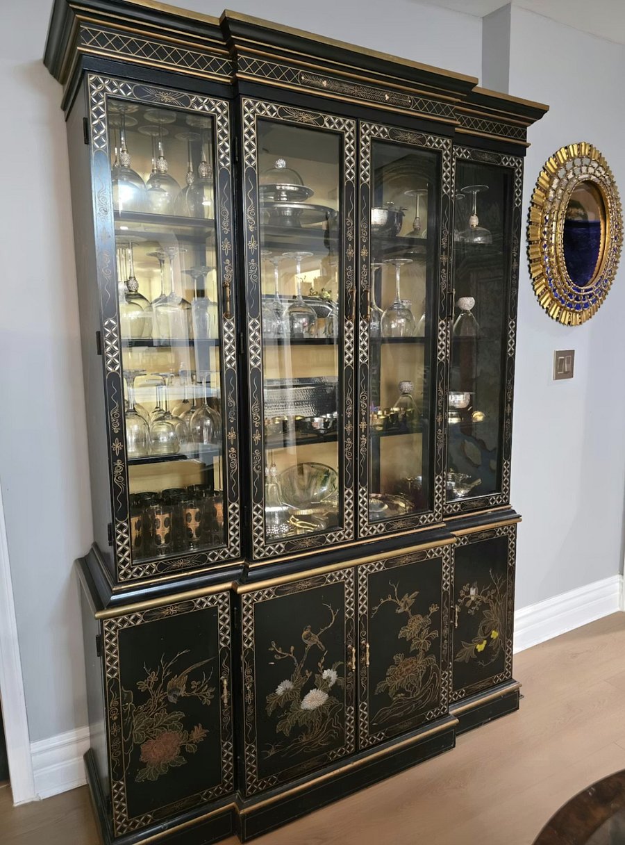 Decorative China cabinet offering functional storage and classic detailing.