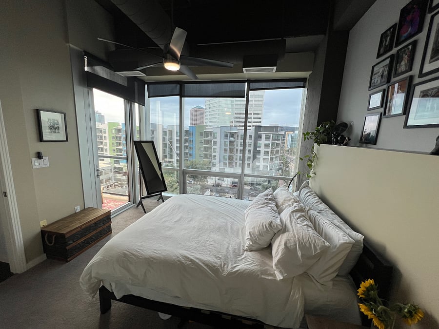 Primary bedroom (mirror, bed, nightstands included in rental. Personal decor and plants will be removed for renter)