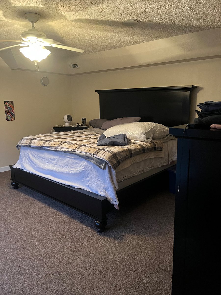 King size bed in master suite. Linens belong to current Renter.