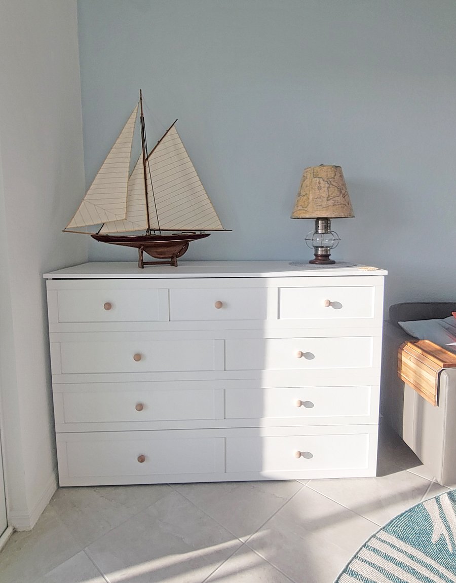 Queen-sized cabinet murphy bed with 8" mattress and 2" foam topper.