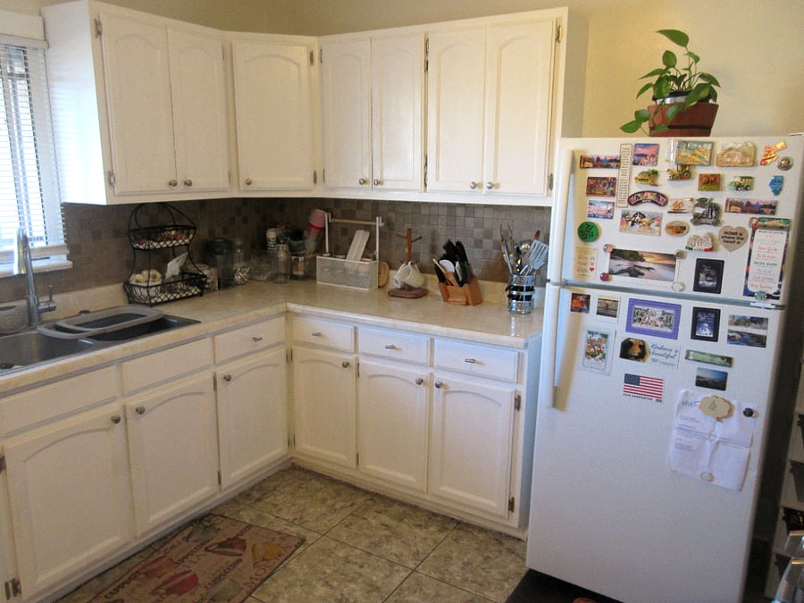 Shared kitchen space with sink, full-size fridge, cabinets, etc.