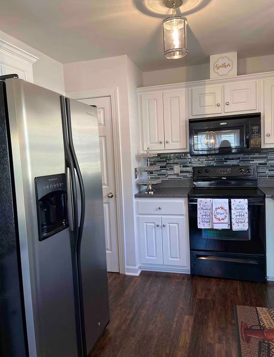 Kitchen view, refrigerator, stove counter