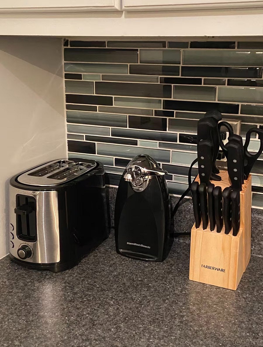 Kitchen view, toaster, can opener & knives