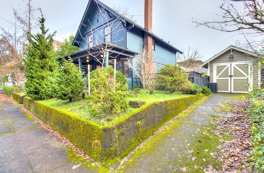 The F. C. Eckhoff house. Go up the driveway toward the garage and through the gate to the Backhouse located behind the F. C. Eckhoff house.