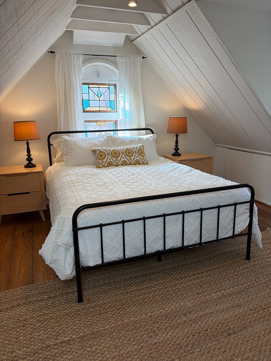 Queen bed in charming upstairs bedroom. 