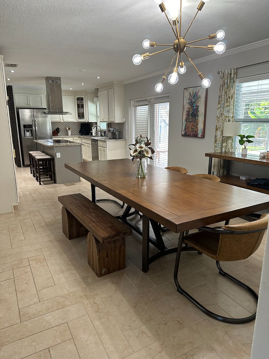 Dining Room: Large family style table with bench and individual seating.