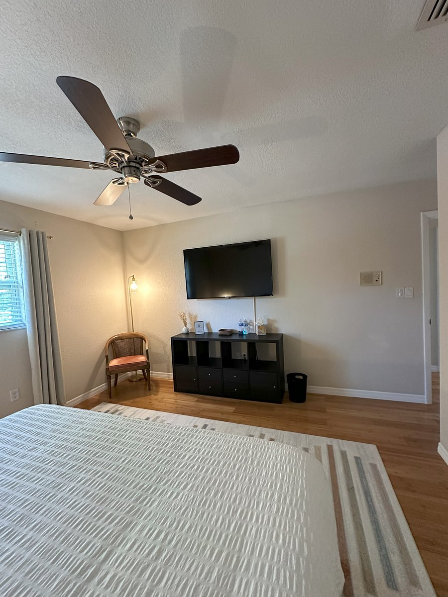 Bedroom 1: King Bed, walk-in closet, 55" TV, blackout curtains.