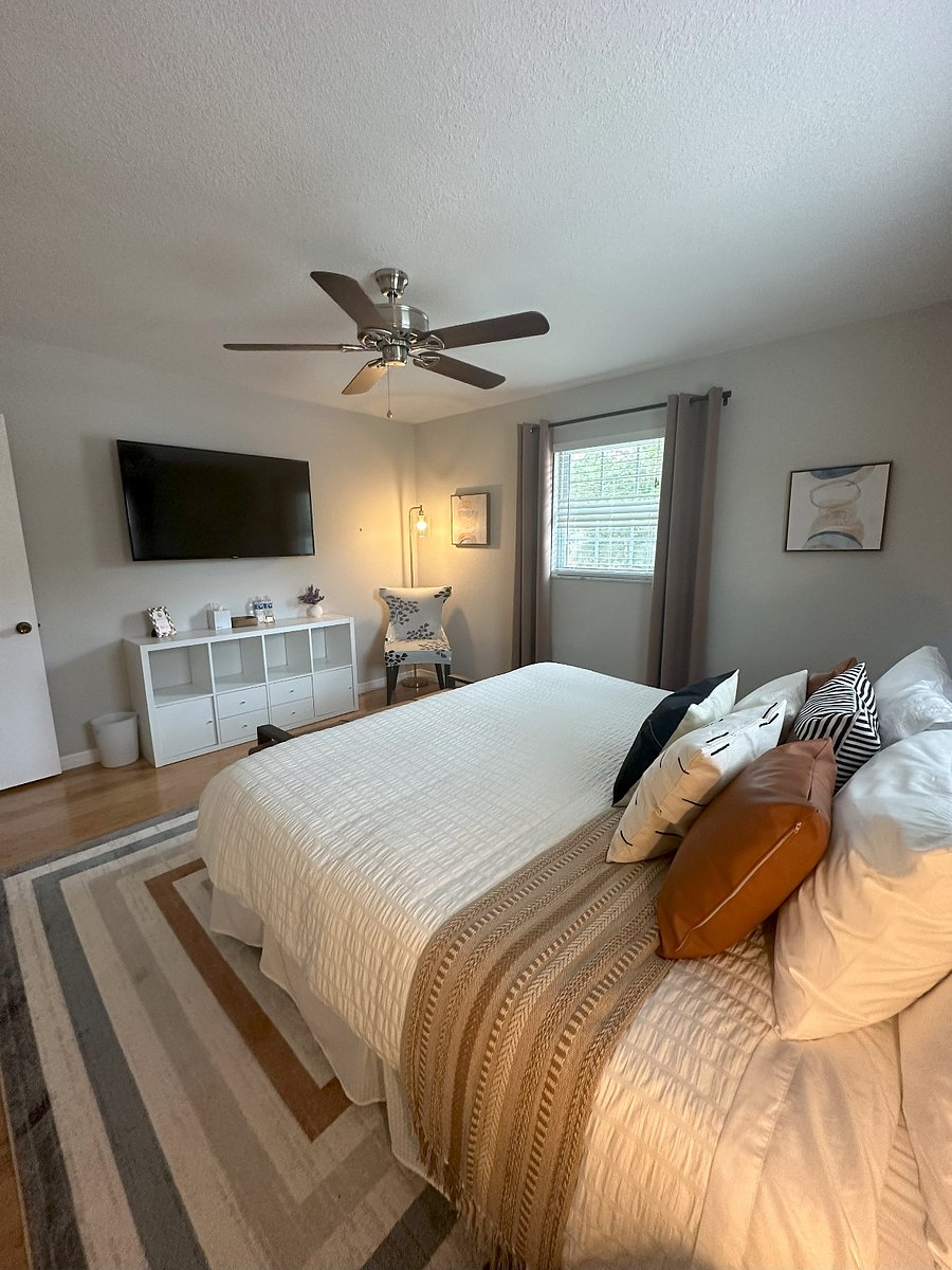 Bedroom 2: King Bed, double closet, 55" TV, blackout curtains.
