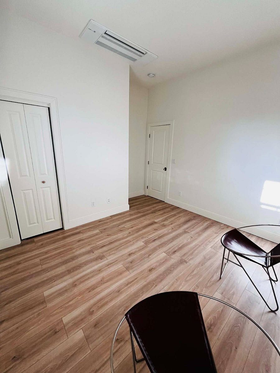 Closet door on the left and bedroom door seen on the right.