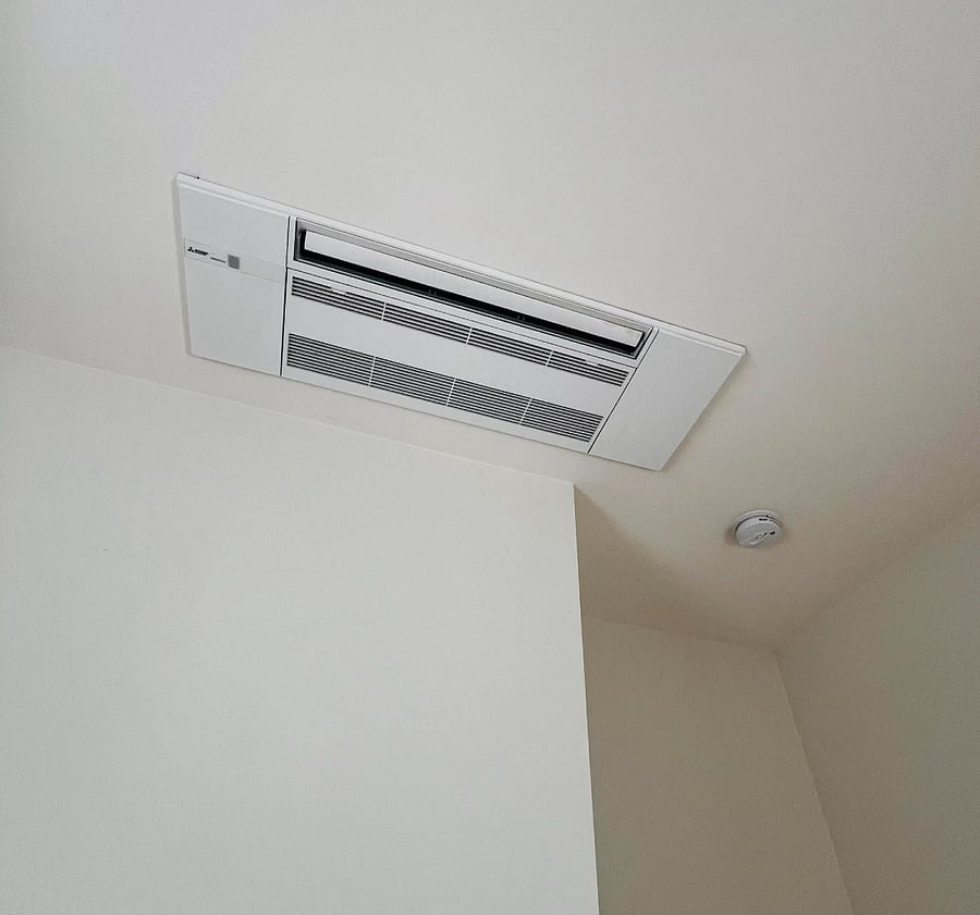 Mini split in ceiling for heating and A/C.