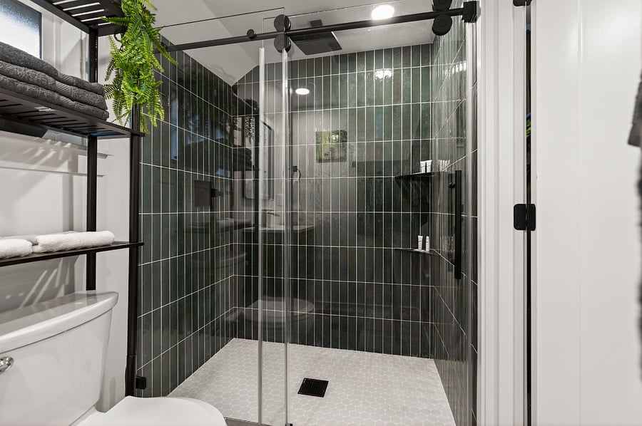 Rain shower oasis with jungle-inspired green tile