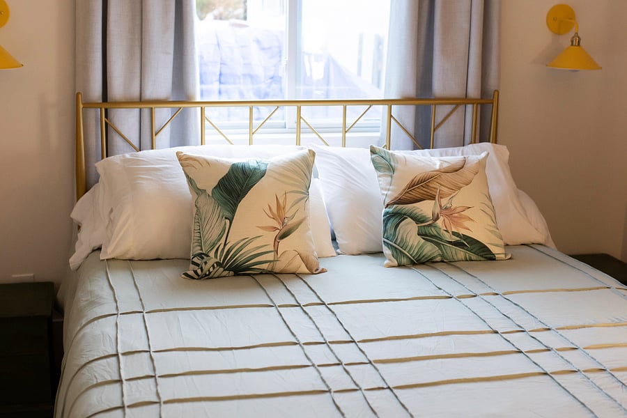 Comfortable sleeping area with queen-size bed, 100% blackout curtains, and a peaceful setting - perfect for night-shift professionals and extended stays.