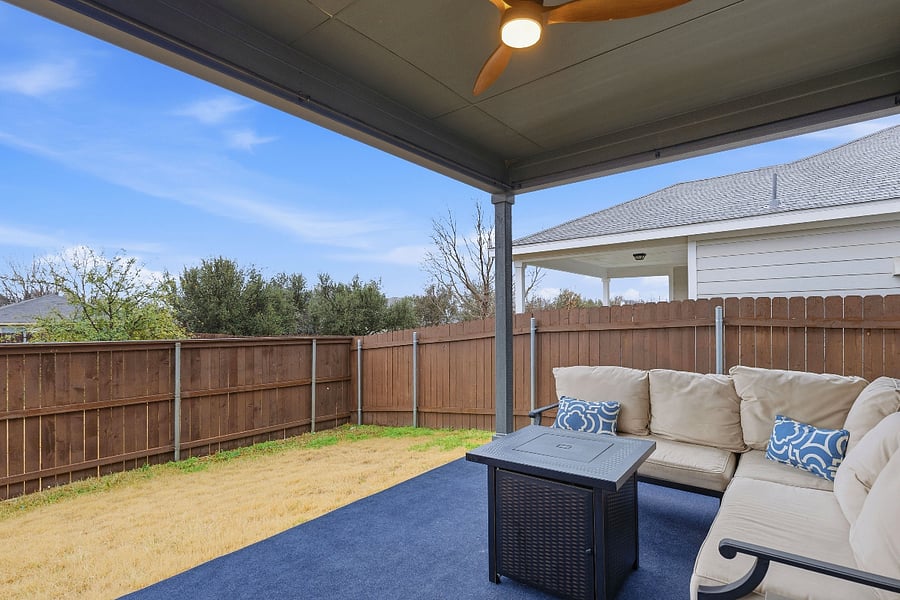 large covered patio + fire pit