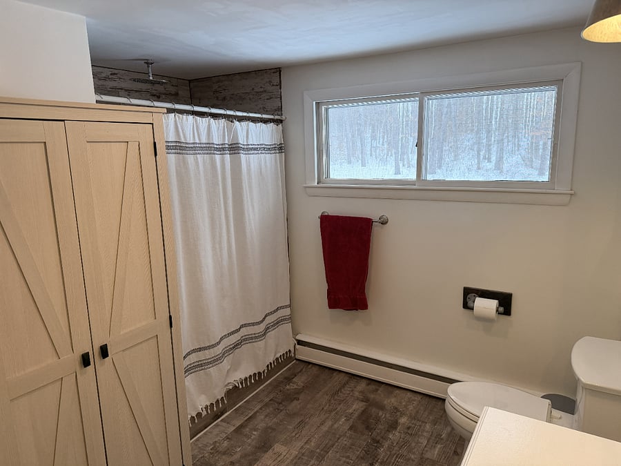 Shared bathroom with shower.