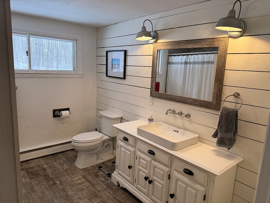 Shared bathroom with shower.
