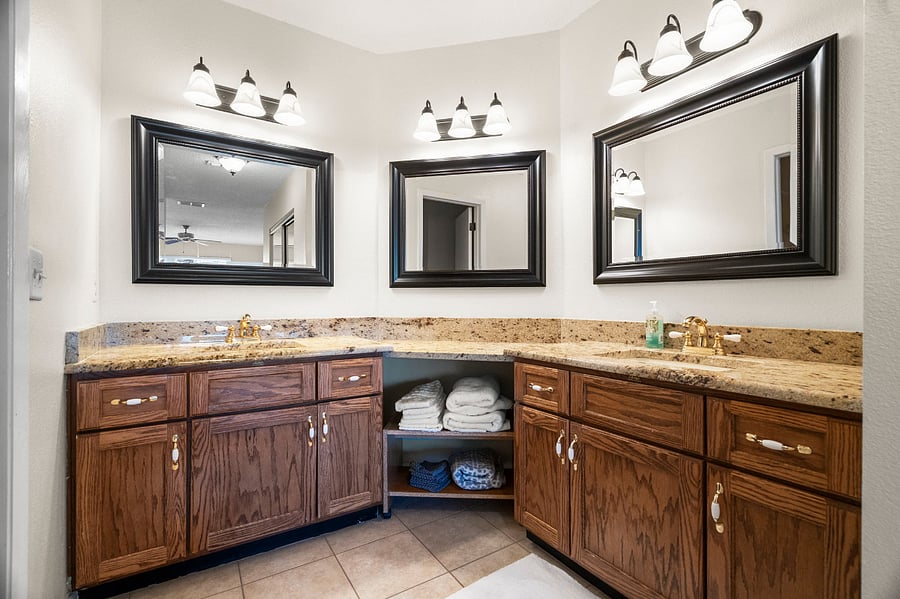 Main private master bathroom with two sinks, shower and separate toilet room.