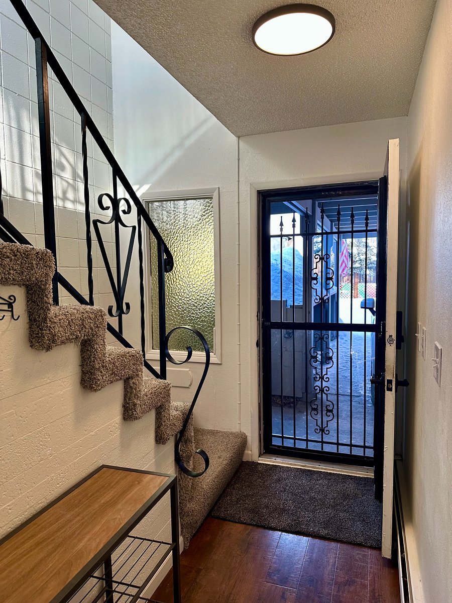 Front door entry, shoe and coat storage area, and access to carport.