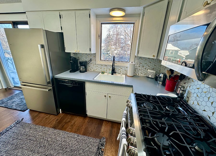 To the left of the sink, there's a convenient coffee station with Keurig and small drip coffee marker; pods, grounds, liquid creamers, and sugar are provided.