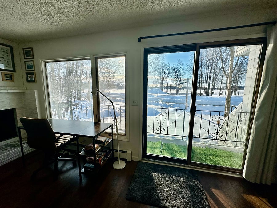 Dedicated workspace with padded rolling desk chair, LED desk lamp, lots of natural light, and lovely outdoor views.