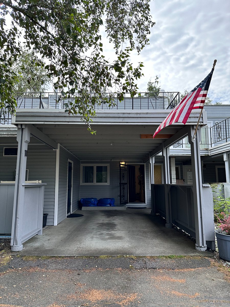 Carport for guest use. Access to the unit is through the front door shown at the upper right. Large deck area sits on top of the carport.