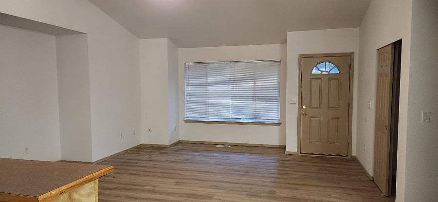 Entry door and living room.