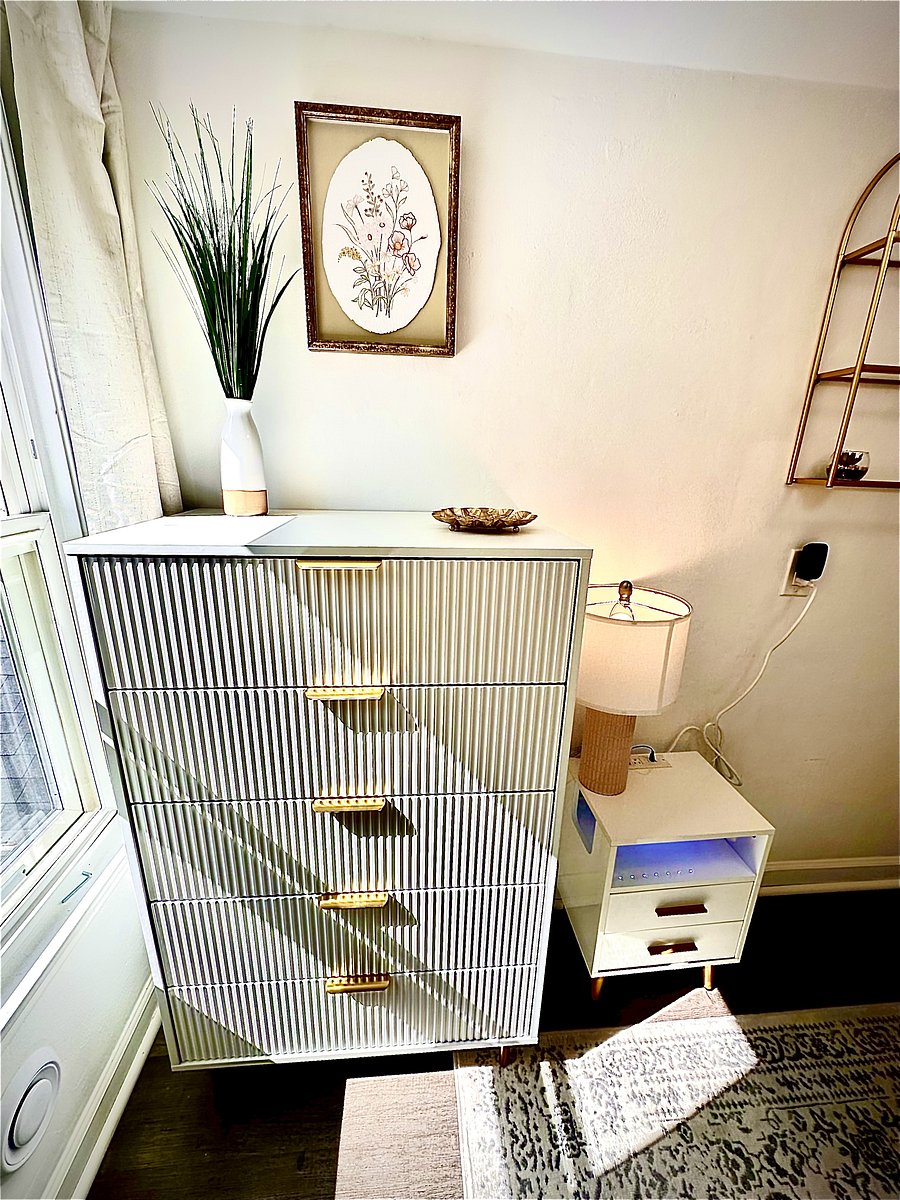 Generous dresser storage and bedside area provide plenty of space to unpack and settle in comfortably for an extended stay.