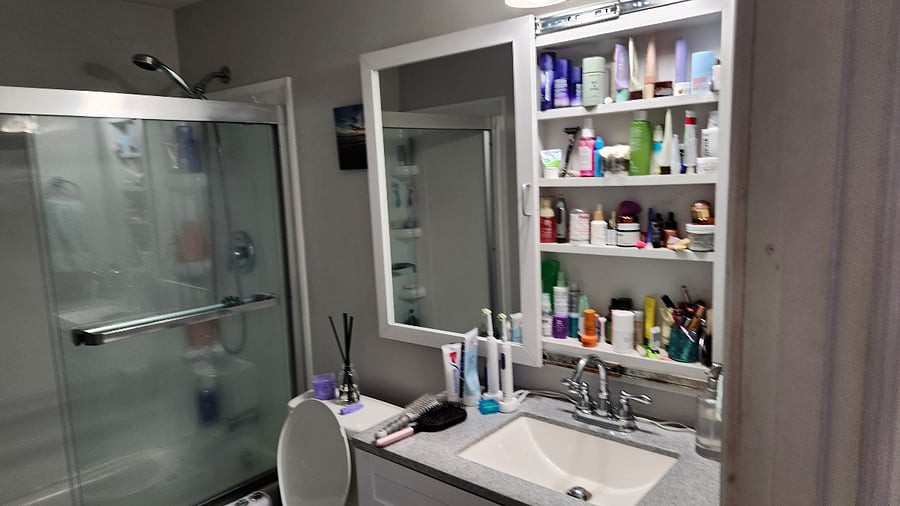 hidden "medicine cabinet" behind sliding mirror
