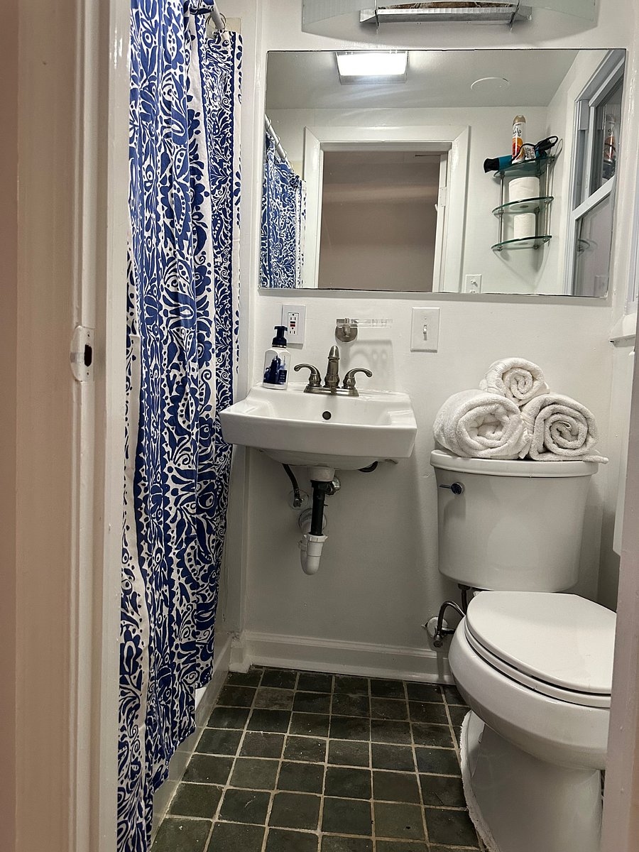 Bathroom with multiple sets of towels. 