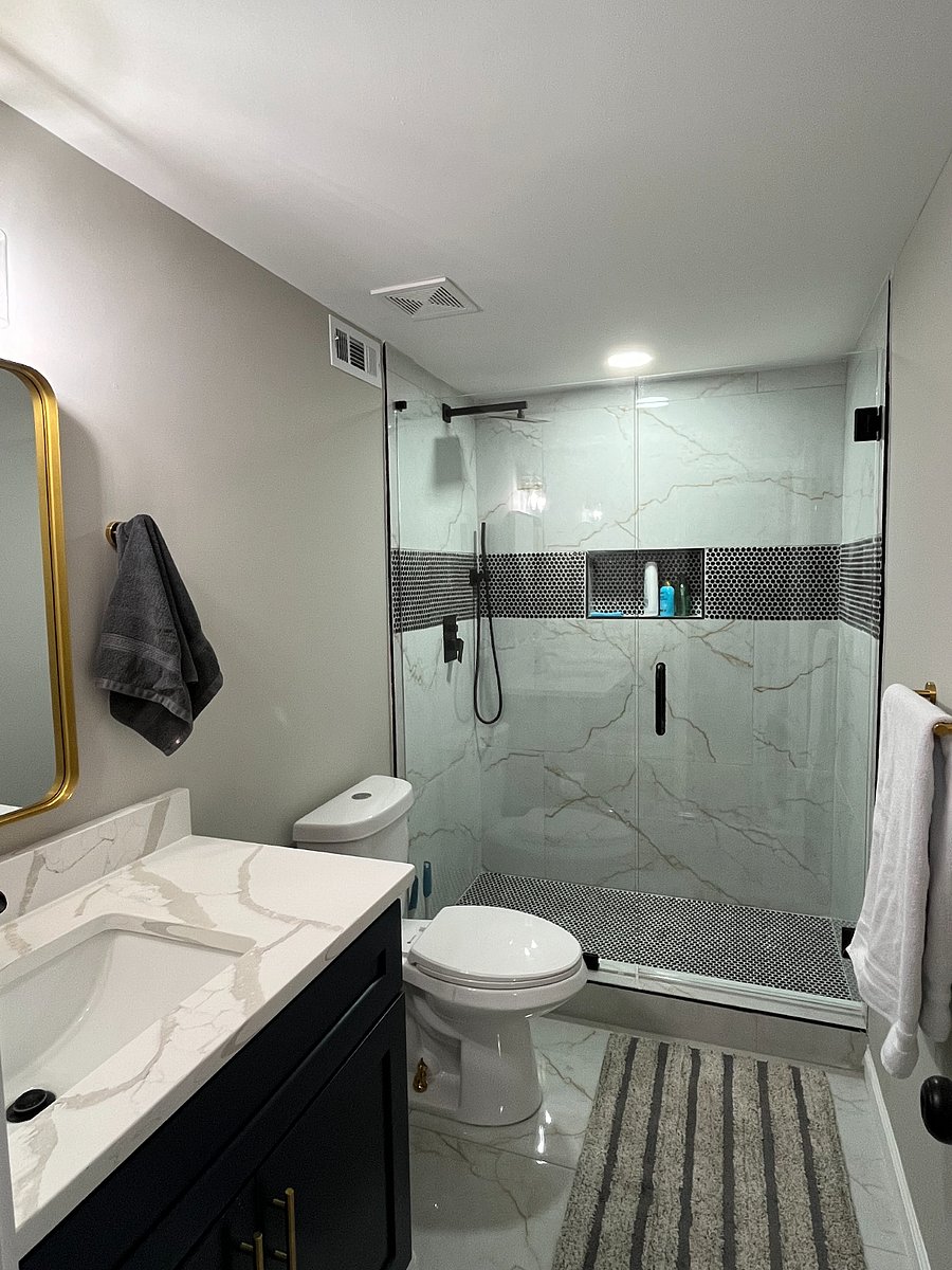 Walk in shower with rain shower head.