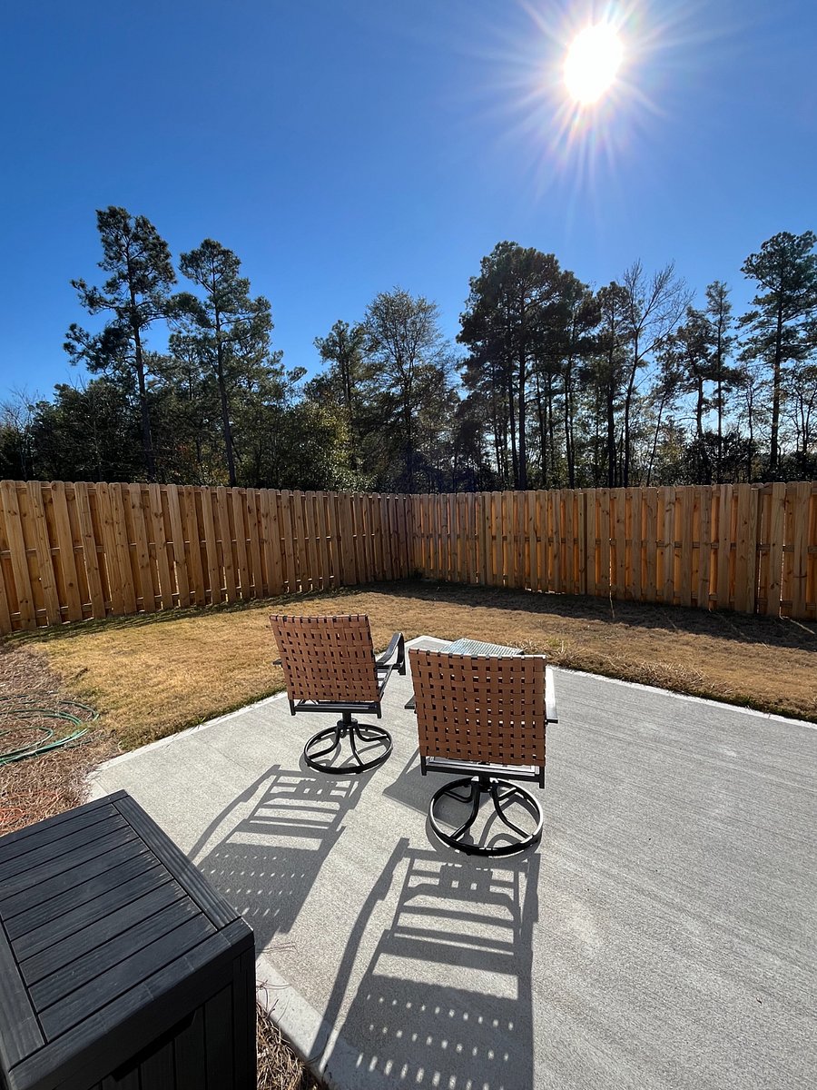 Fenced in backyard and seating