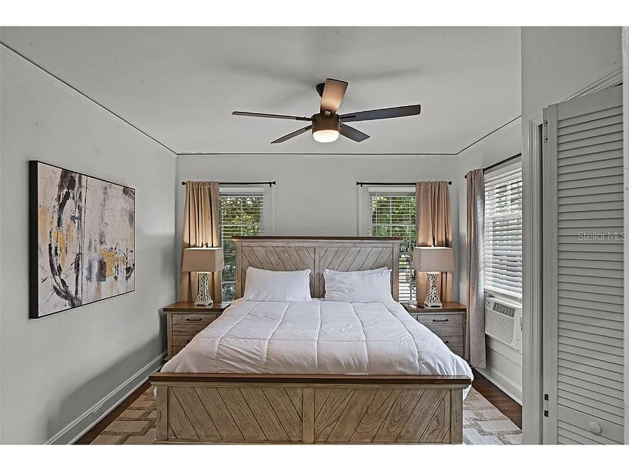 Primary bedroom with king sized bed and smart YV