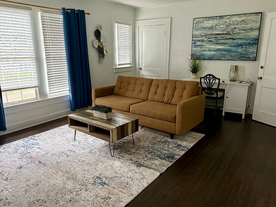 Living room with work desk in rear