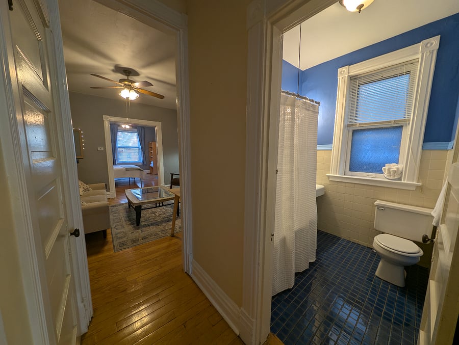Tile bathroom, clawfoot tub/shower combo; 100% cotton shower curtain, mini blinds, 100% cotton towels and washcloths. Cotton rugs, also but left out of photo to see floor. :) 