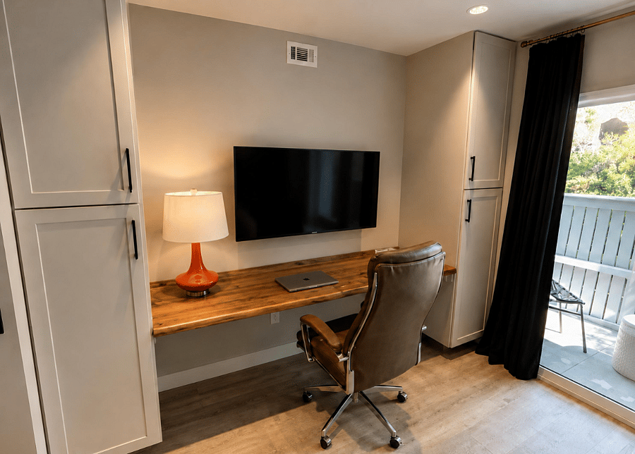 Dedicated home office with live-edge desk, executive chair & blazing-fast 1 Gig Wi-Fi