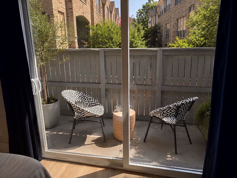Private off-suite balcony with comfortable seating - perfect for morning coffee, evening wine, or unwinding outdoors