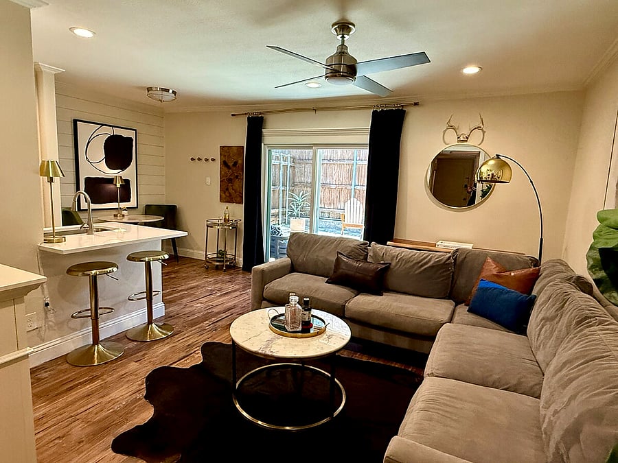 Modern design meets functionality with comfortable sectional and a marble-topped coffee table!