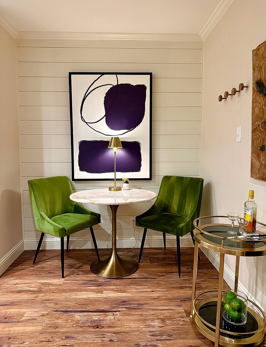 Boutique-style dining nook with marble table and velvet chairs, a stylish corner for meals or coffee