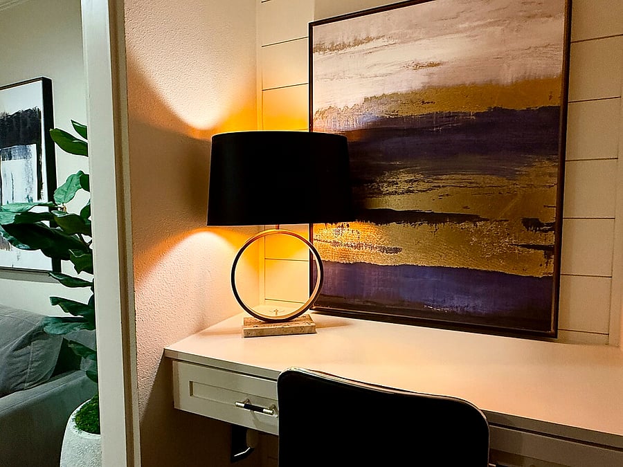 Dedicated workspace with sleek desk, designer lighting, and fast Wi-Fi, perfect for remote work