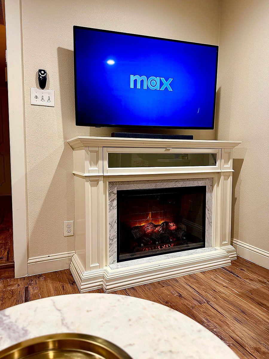Stylish space with a Smart TV and an electric fireplace for movie nights!