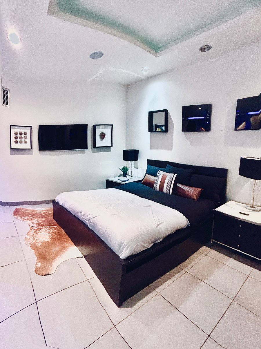 Bedroom with queen bed, Roku streaming TV, high-powered, air purifier's & adjustable lighting with dimmer switches