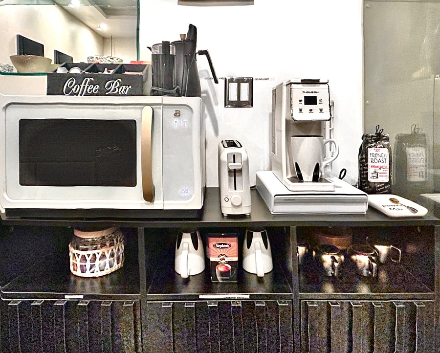 Coffee bar, toaster, and microwave.