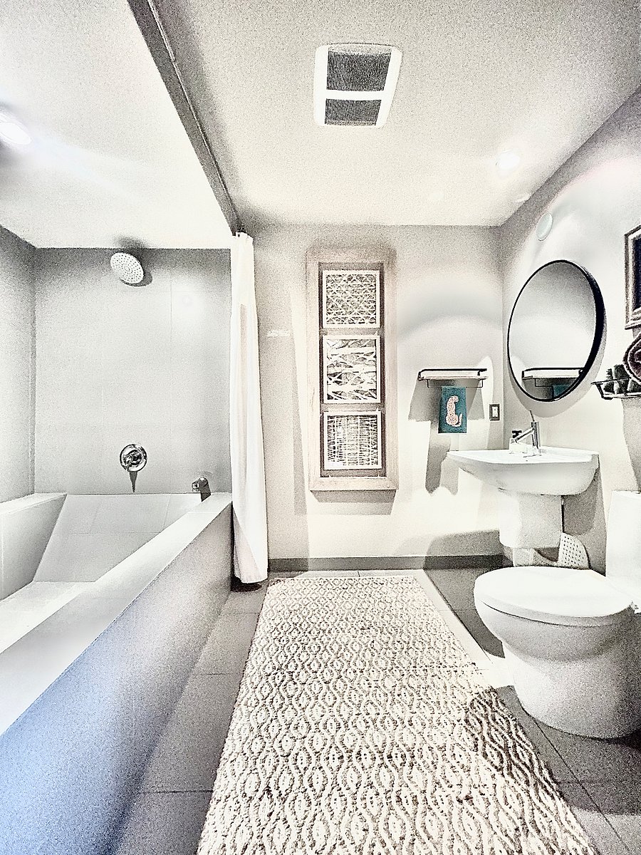 Full bathroom, shower and bath tub.
