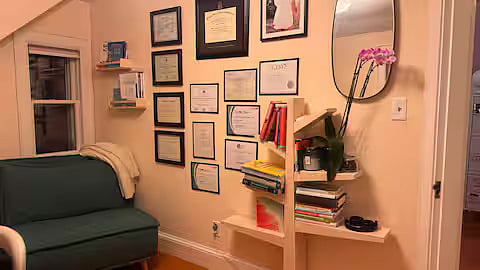 Office upstairs with standing desk and couch that unfolds to single mattress