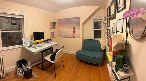 Office upstairs with standing desk and couch that unfolds to single mattress