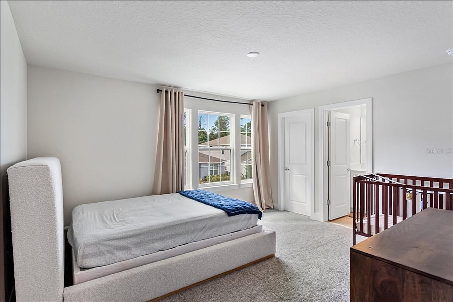 Bedroom with on suite bathroom walk in closet