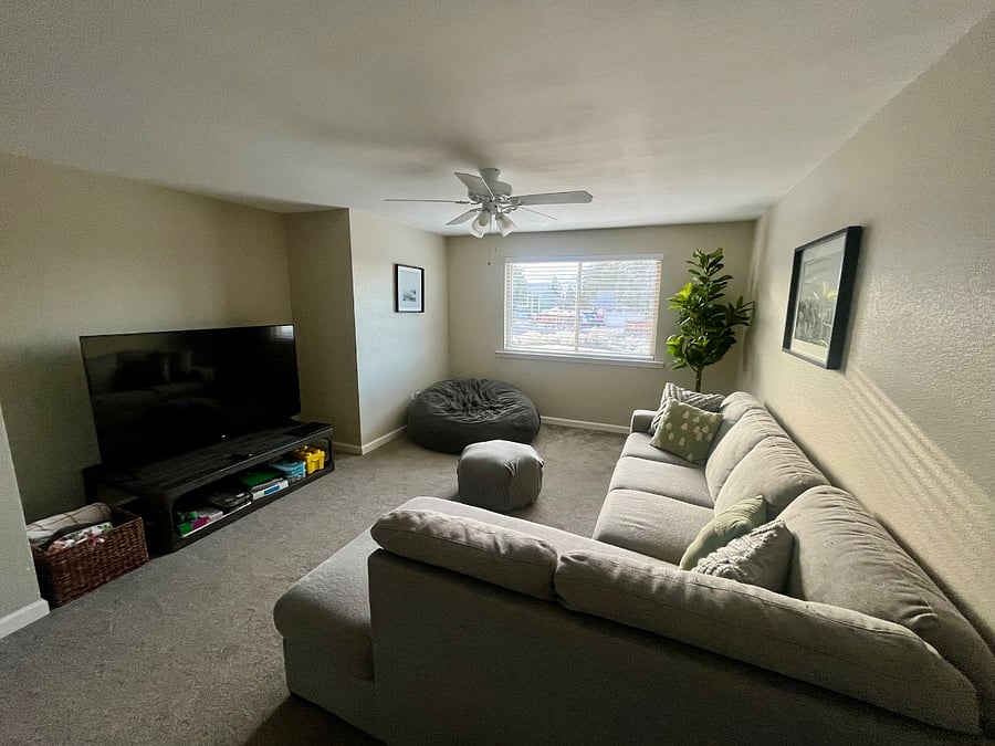 Entertainment room with 65 inch tv, board games, puzzles, and extra large bean bag