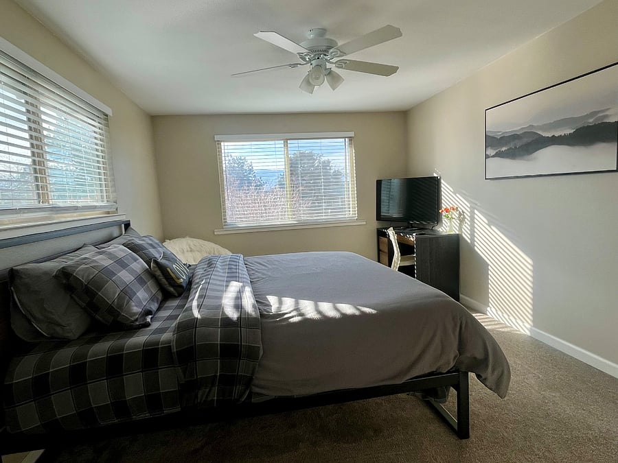 Front bedroom with king bed and smart tv