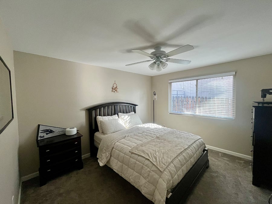 Middle bedroom with queen mattress and ample closet space
