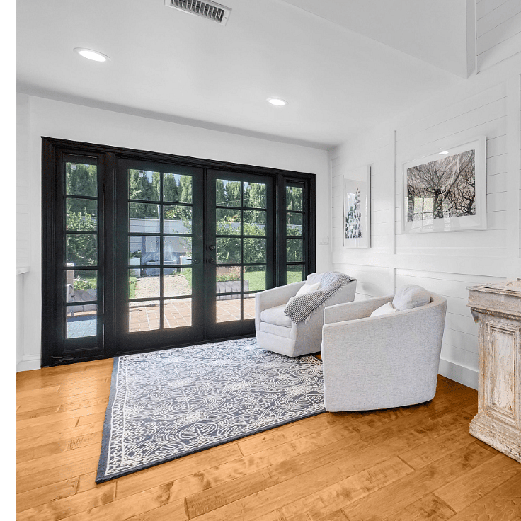 French doors to back patio with view of the fountain.