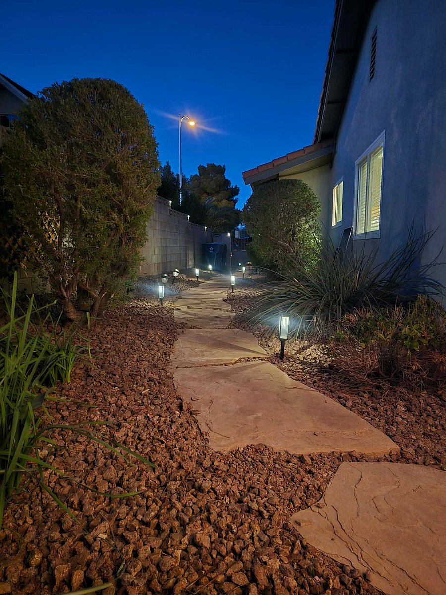 Side yard path to front yard with lights